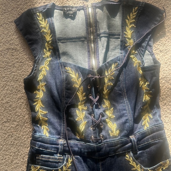 Bebe Embroidery Detail Sleeveless Flared Denim Jumpsuit - Picture 1 of 4